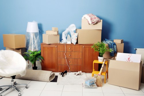 Removals team handling a move near Highbury streets and apartments