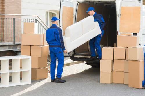 Charity-donated furniture and reusable items being organised