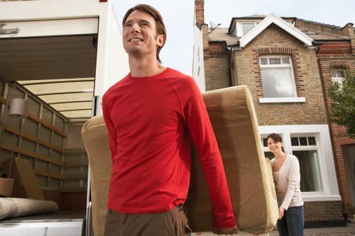 Loading moving boxes into a van in a Highbury street