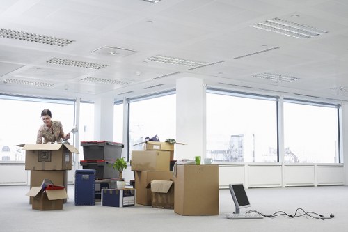Local removals team handling boxes and furniture in Highbury