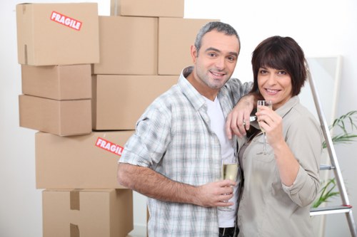 Careful wrapping of fragile household items in Highbury