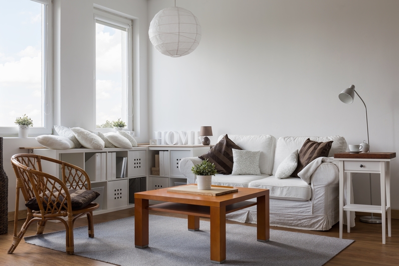 Moving team handling furniture in a Highbury flat